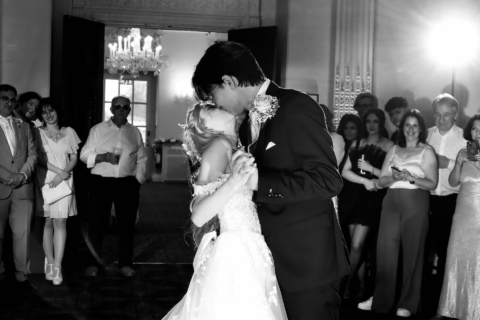 A bride and groom sharing a kiss on the dance floor at Buxted Park Hotel